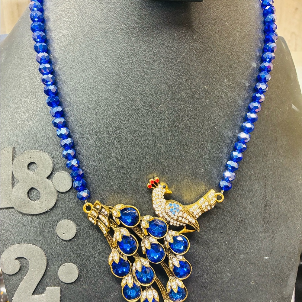 Elegant Blue and Gold Peacock Necklace - Picture 2 of 3